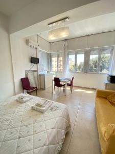 a bedroom with a bed and a table and chairs at Abruzzi 81 in Lecce