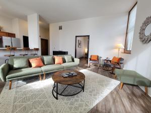 a living room with a couch and a table at District Attorney's Office in Rochester