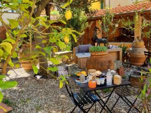 a table with food on it in a garden at B&B Firenze 400 in Florence