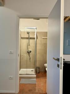 a bathroom with a shower with a glass door at Casa Viaggi in Castel Guelfo di Bologna
