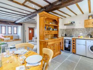 a kitchen and dining room with a table and chairs at 2 Bed in Ulverston 83453 in Great Urswick