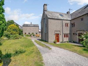 an external view of a house with a driveway at 2 Bed in Ulverston 83453 in Great Urswick