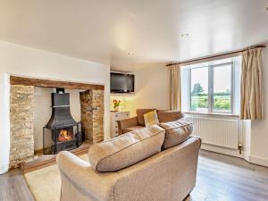 a living room with a couch and a fireplace at 2 bed in Dartmoor National Park WAYTO in Ashbury