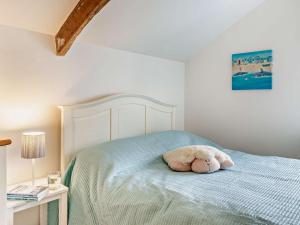 a stuffed animal laying on a bed in a bedroom at 2 bed in Dartmoor National Park WAYTO in Ashbury