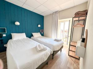 Postel nebo postele na pokoji v ubytování Mon P'tit Hôtel