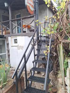 a set of stairs leading up to a building at Szalupa Hostel Airport in Zakroczym