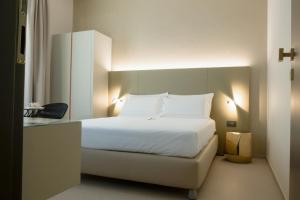 A bed or beds in a room at B&B il Divino