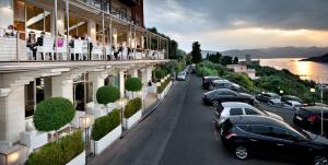 a street with cars parked on the side of a building at Europa Grand Hotel in Lerici