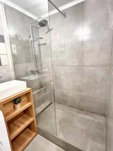 a shower with a glass door in a bathroom at Studio with wifi at Bruxelles in Brussels