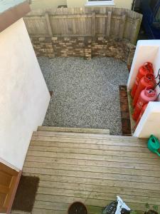 an overhead view of a backyard with a wooden deck at Rose Cottage in Lustleigh