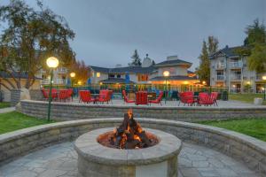 a fire pit in a park with chairs and tables at Beach Retreat & Lodge at Tahoe in South Lake Tahoe