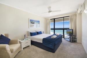 A bed or beds in a room at Clubb Coolum Beach Resort