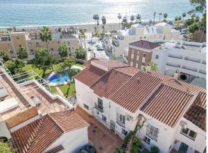 an aerial view of buildings and the beach at Burriana Casa Playa in Nerja