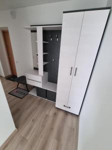 a room with a white cabinet and a mirror at Trumpalaike buto nuoma in Rokiškis +16 photos