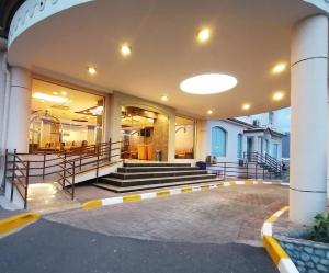 a lobby of a building with a bunch of stairs at Nizwa Hotel Apartments in Nizwa