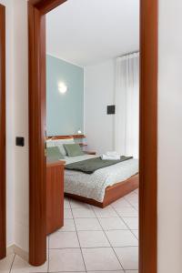 a bedroom with a bed in a room at Spacious Exclusive Apartment in Pioltello