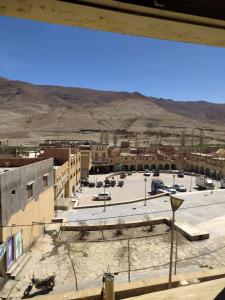 a view from a window of a parking lot at hotel atlas in Imilchil