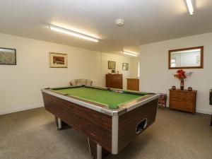 a living room with a pool table in it at Blorenge in Abergavenny