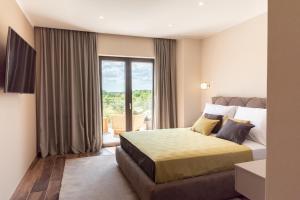 Ένα ή περισσότερα κρεβάτια σε δωμάτιο στο Villa Alessandro +92 φωτογραφίες