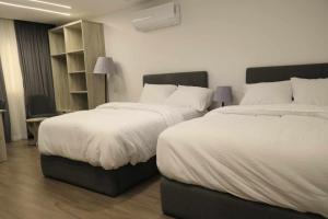 Ένα ή περισσότερα κρεβάτια σε δωμάτιο στο elhosary motel