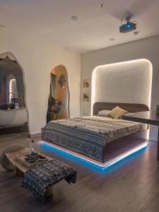 a bedroom with a large bed with lights on it at Cine Homestay - Căn hộ cao cấp Ecopark Hải Dương in Hải Dương