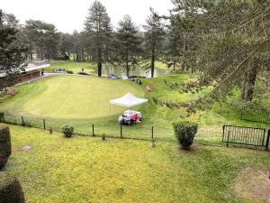 an aerial view of a park with a white tent at Bienvenue au Green in Neufchâtel-Hardelot