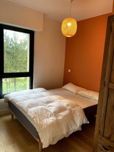 Postel nebo postele na pokoji v ubytování Bienvenue au Green