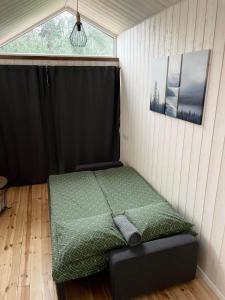 Postel nebo postele na pokoji v ubytování Palūšės Kempingas (nameliai)