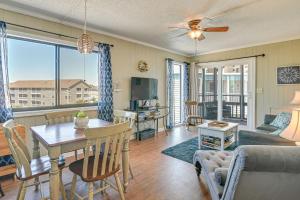 a living room with a table and a couch at Coastal Condo on Beach with Community Pool Access! in Myrtle Beach