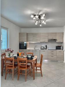 A kitchen or kitchenette at Terme Apartment Levico
