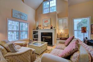 a living room with a couch and a fireplace at Ingen Trafikk in Southport