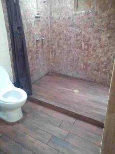 a bathroom with a shower with a toilet in it at Cabaña Los Hernández in Arteaga