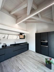 A kitchen or kitchenette at Terme Apartment Levico
