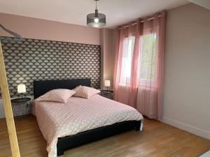 Giường trong phòng chung tại Agréable maison de ville 6 personnes