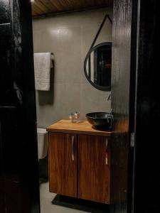 a bathroom with a sink and a mirror at Apto Aventus in Igrejinha