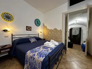 a bedroom with a bed with towels on it at Del Centro in Enna