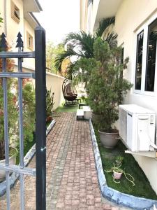 a brick walkway in front of a house at Portland Residence in Lekki