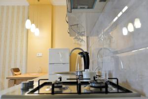 A kitchen or kitchenette at Cozy Apartment In Old Town Kutaisi