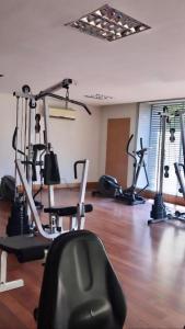 a gym with several exercise bikes in a room at Providencia Studio Suite con Terraza in Santiago