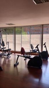 a gym with a bunch of exercise bikes on the floor at Providencia Studio Suite con Terraza in Santiago