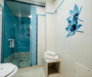 a bathroom with a shower and a toilet and a sink at Riviera Ionica in Santa Teresa di Riva +145 photos