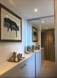 a room with a counter with a mirror and a bathroom at FANTASTIC OCEAN VIEW in Biarritz