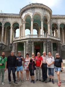 a group of people standing in front of a building at Guest House Coffee in Kutaisi