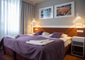 Postelja oz. postelje v sobi nastanitve Hotel Quattro Weekend