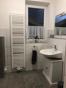 Ένα μπάνιο στο Ferienwohnung Alex