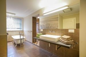 a bathroom with a sink and a mirror at FeWo Konstanze in Borkum