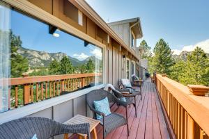 a balcony with chairs and a view of mountains at Cozy Estes Park Condo with Balcony and Fireplace! in Estes Park