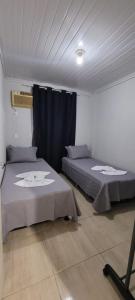 A bed or beds in a room at Casa ao lado da Dubai brasileira