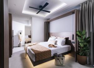 Posteľ alebo postele v izbe v ubytovaní Alcyone Studios and Apartments