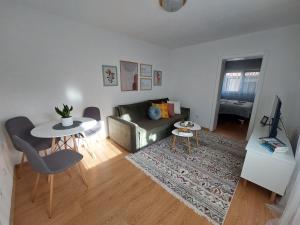 a living room with a couch and a table at Kia Ora in Bihać